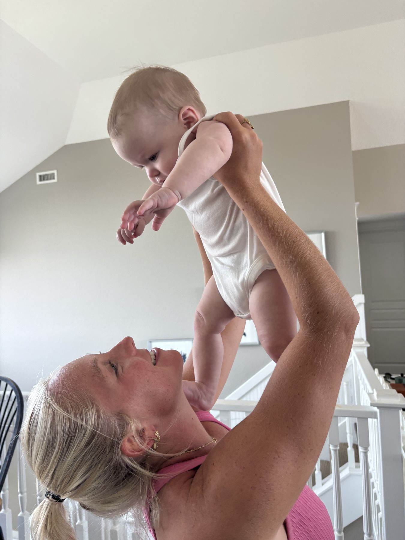 Lane lifting the baby up