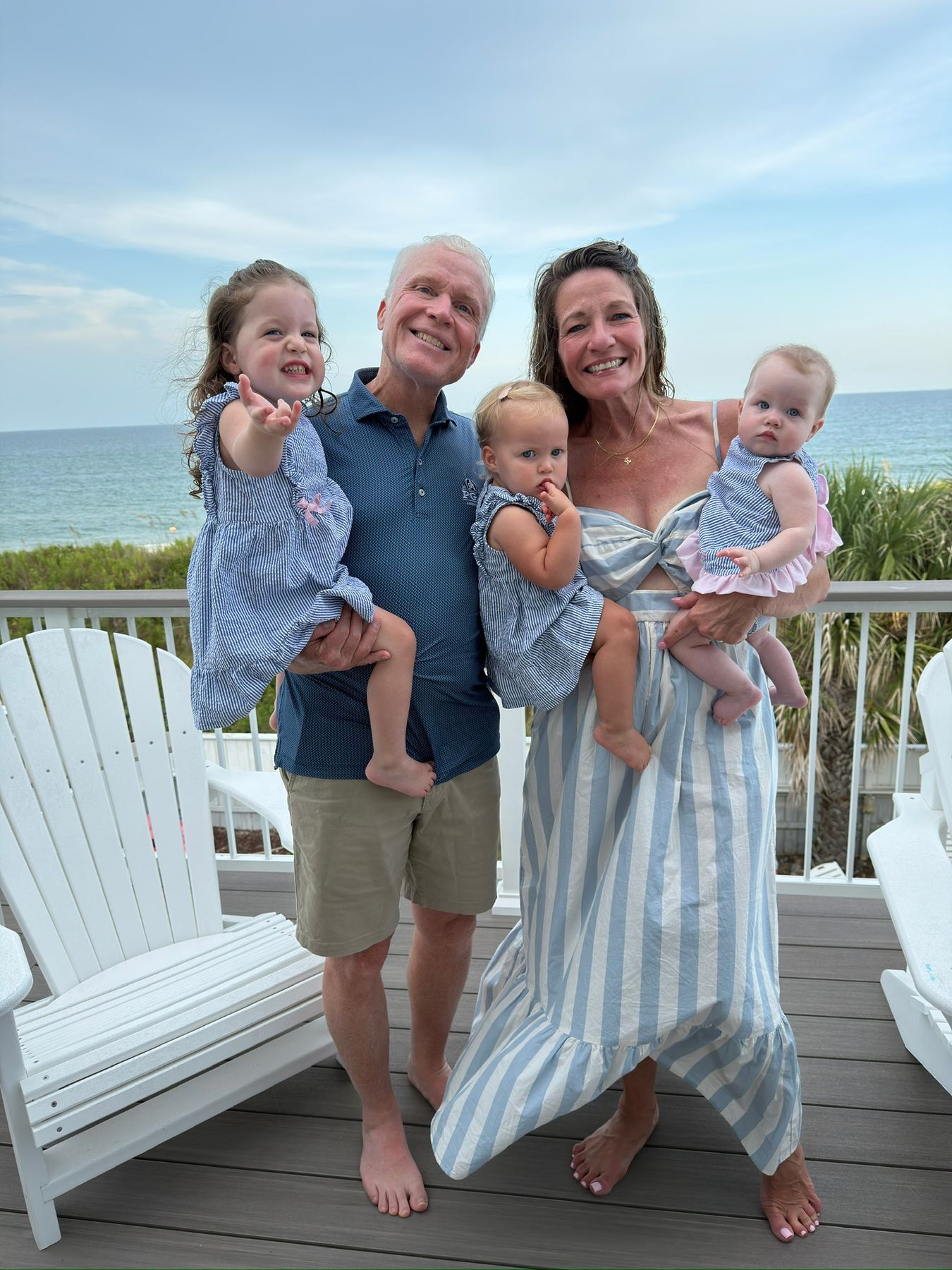 Mom and Dad with the girls on the deck