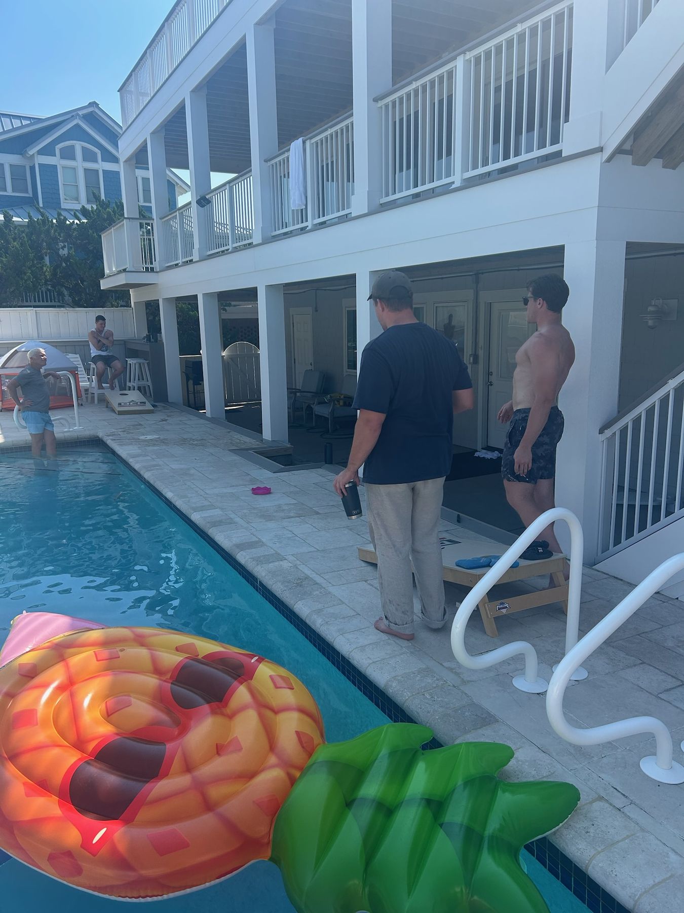 Cornhole by the pool