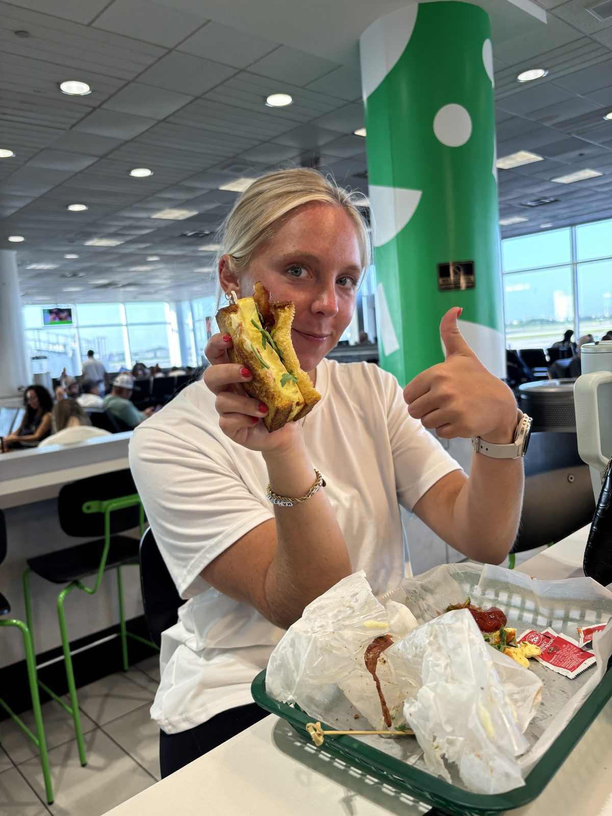 Aud with egg sandwich at airport