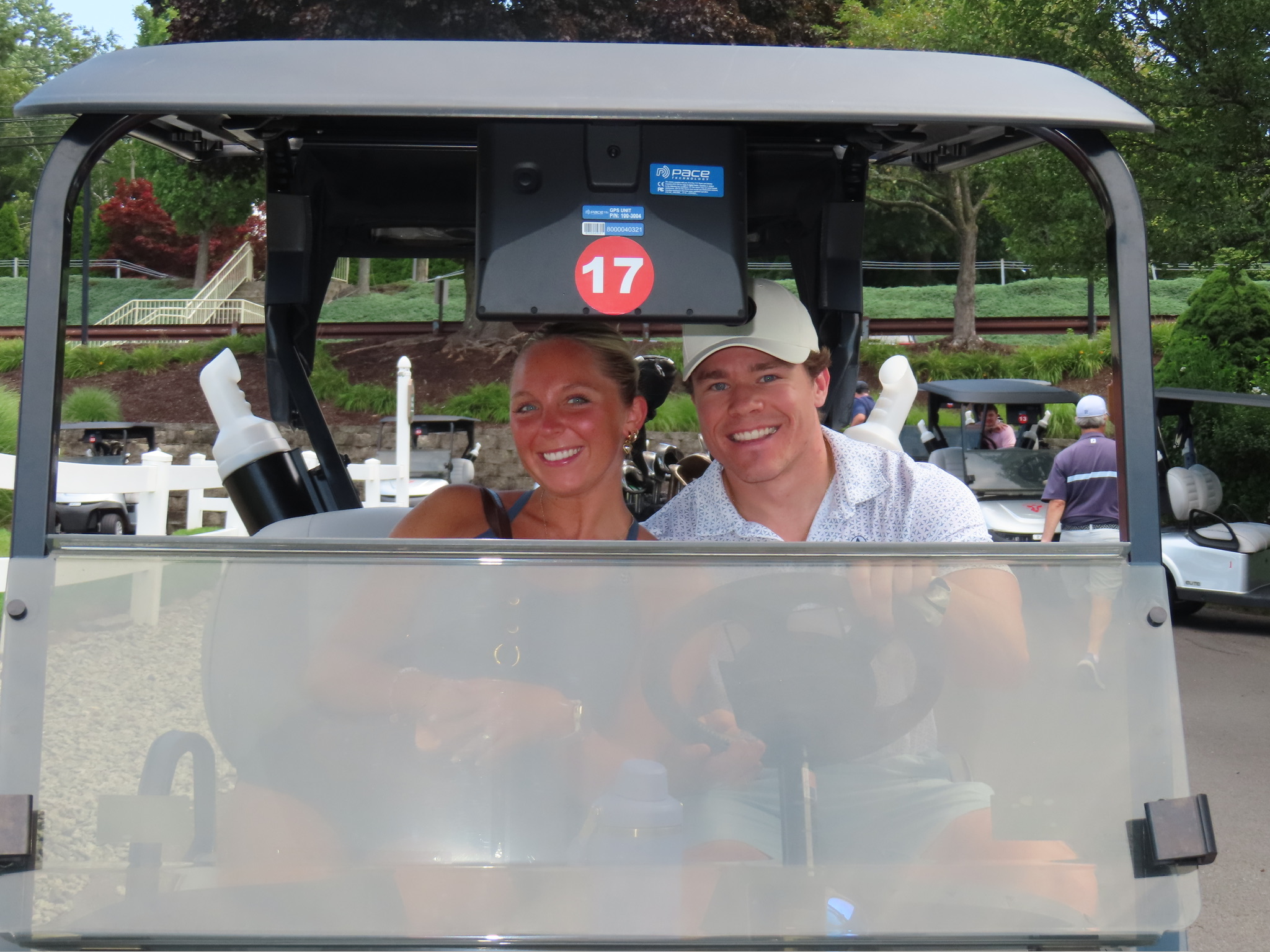 A and Lane in golf cart